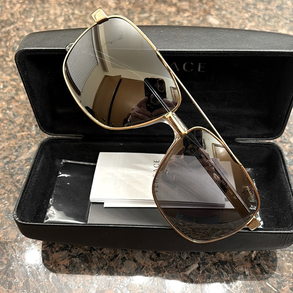 Versace unisex VE2174 Gold Rimmed Polarized Sunglasses, dark grey lenses.